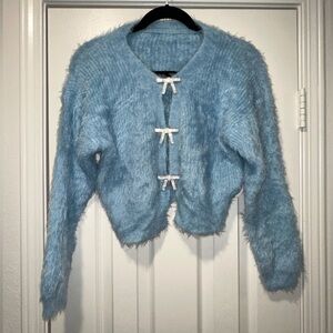 J.ING - Fuzzy Cropped Cardigan with Rhinestone Bow Detail (blue) size O/S